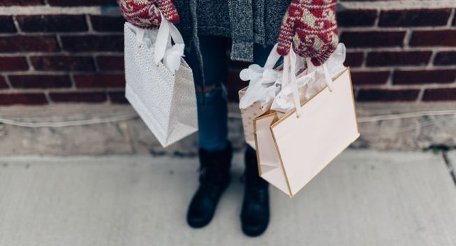 A young woman out shopping for Christmas presents
