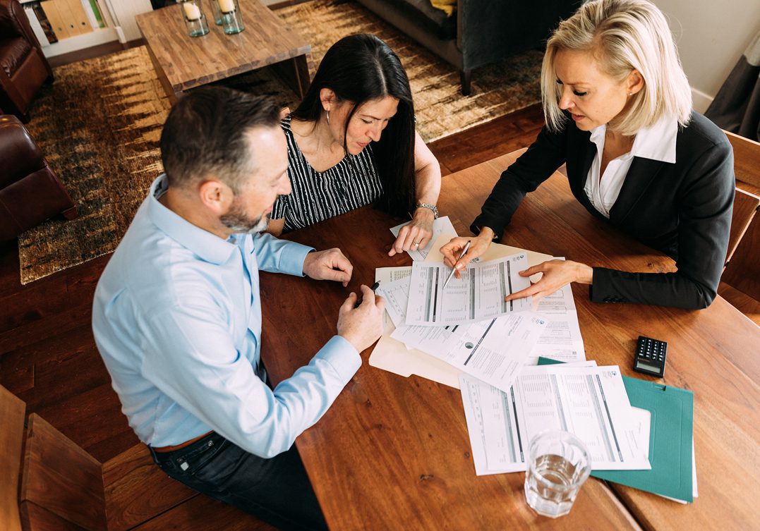 Business meeting around a wooden table