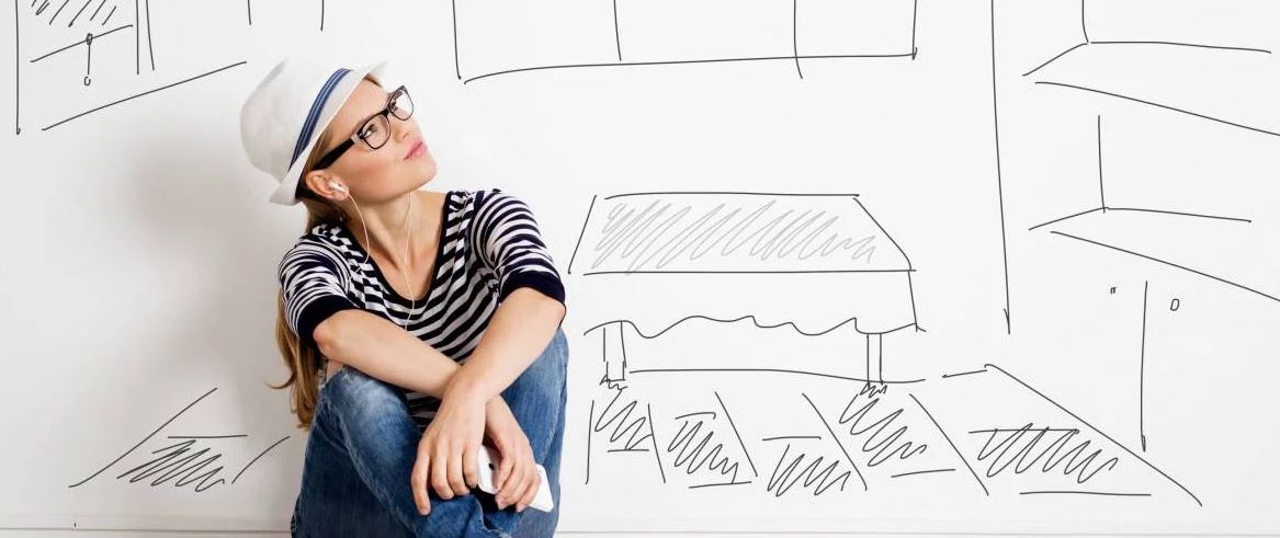 Creative woman with glasses and hat