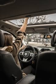 Car interior with driver and sunroof