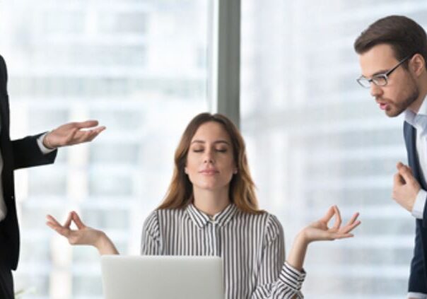 Office tension with meditating employee
